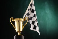 15648656-checker-flag-stands-on-trophy.jpg